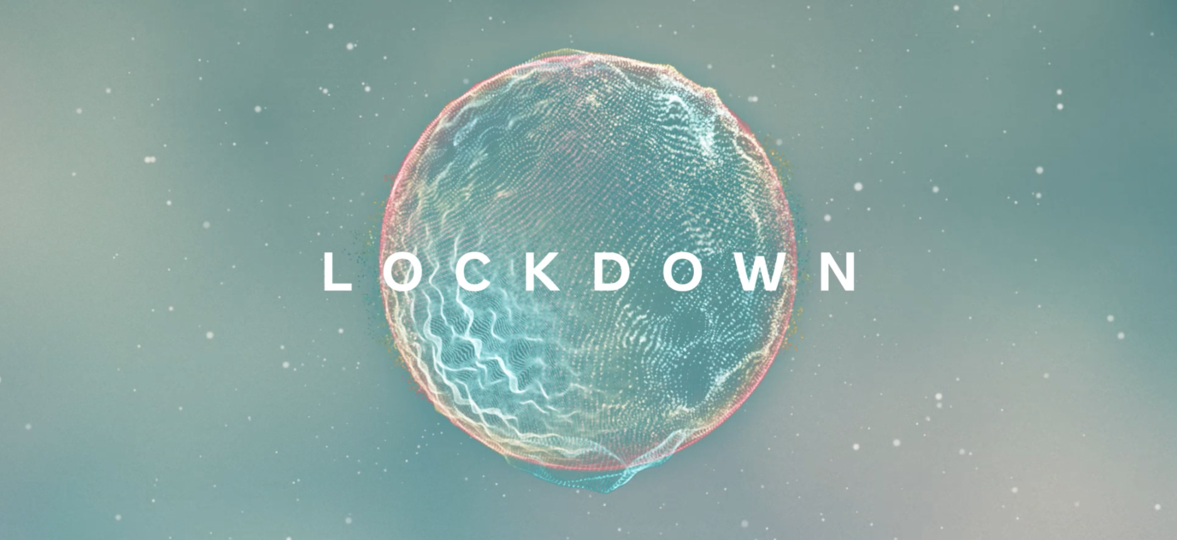 two people sitting on a ledge talking